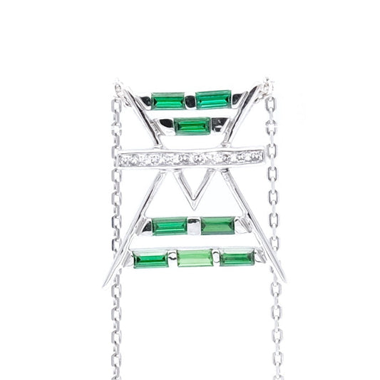 Jewelry with green gemstones and a gold chain on a white background