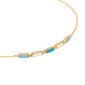 Gold bracelet with blue and white hexagonal links on a white background