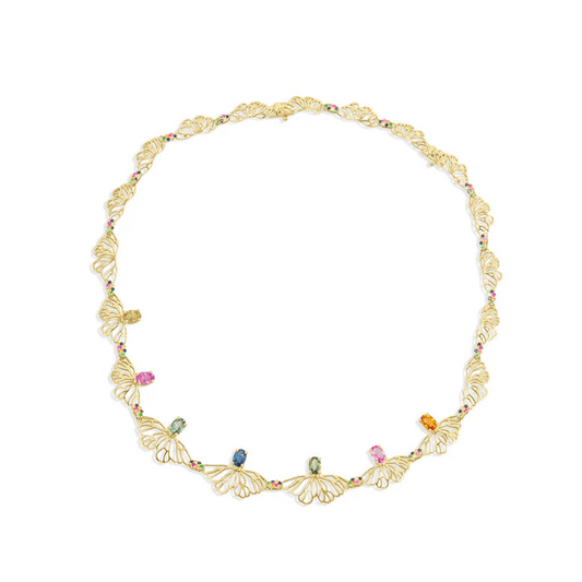 Gold necklace with colorful stones on a white background