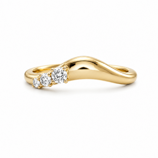 Gold ring with three diamonds on a white background