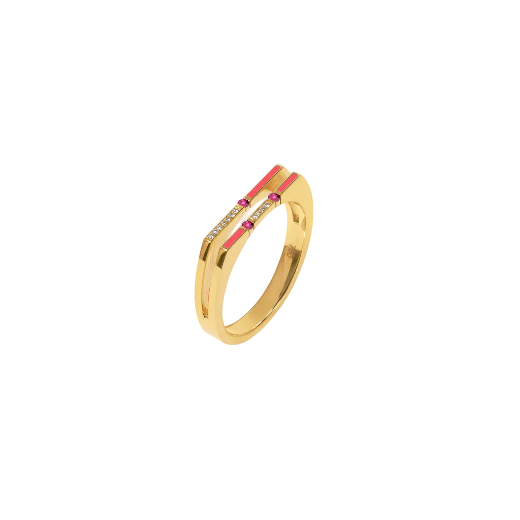 Gold ring with red and pink accents on a white background