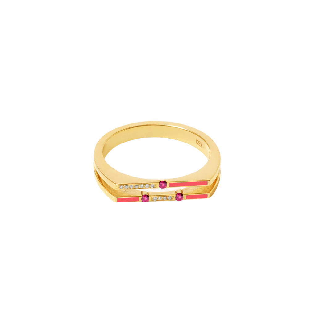 Gold ring with red and clear gemstones on a white background