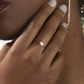 Close-up of a hand wearing the Classiyah Monarch's Crown 18K gold ring