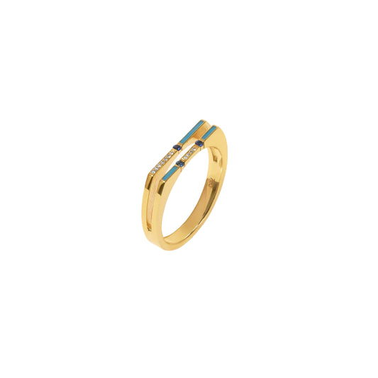 Gold ring with blue gemstone on a white background
