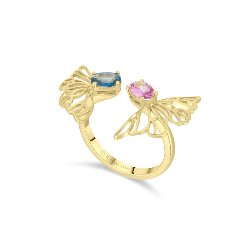 Gold butterfly ring with blue and pink gemstones on a white background