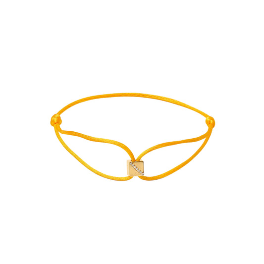 Yellow bracelet with a small square charm on a white background