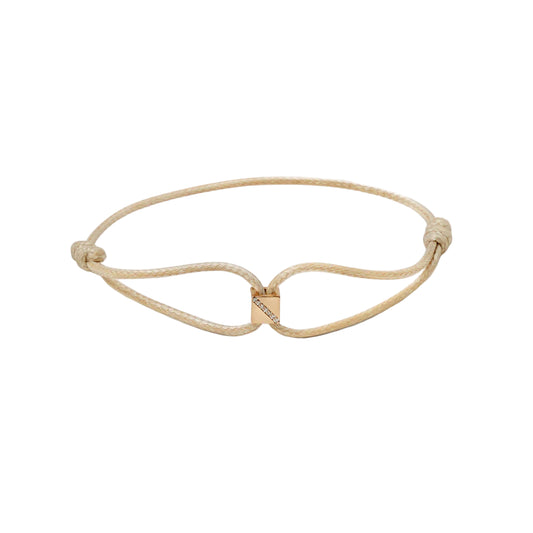 Gold bracelet with a unique design on a white background