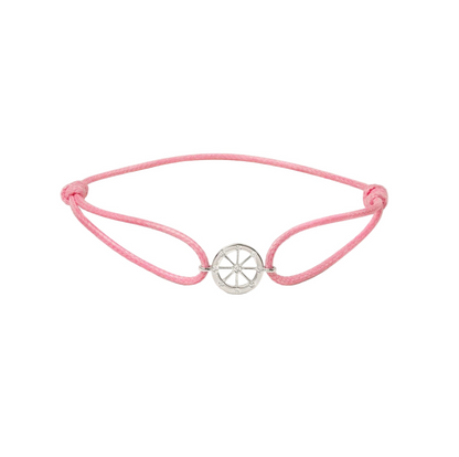 Pink bracelet with a white gold charm on a white background