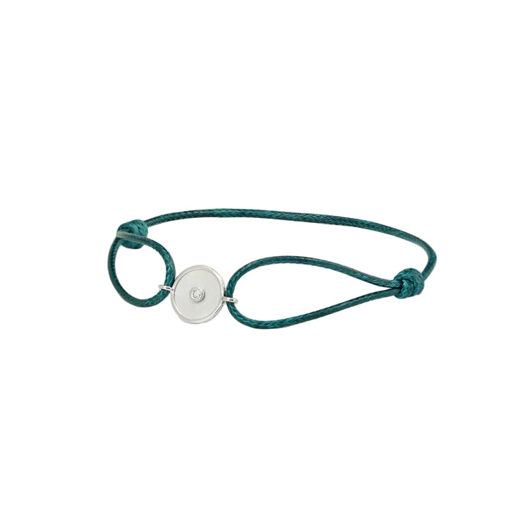 Teal bracelet with a gold button clasp on a white background