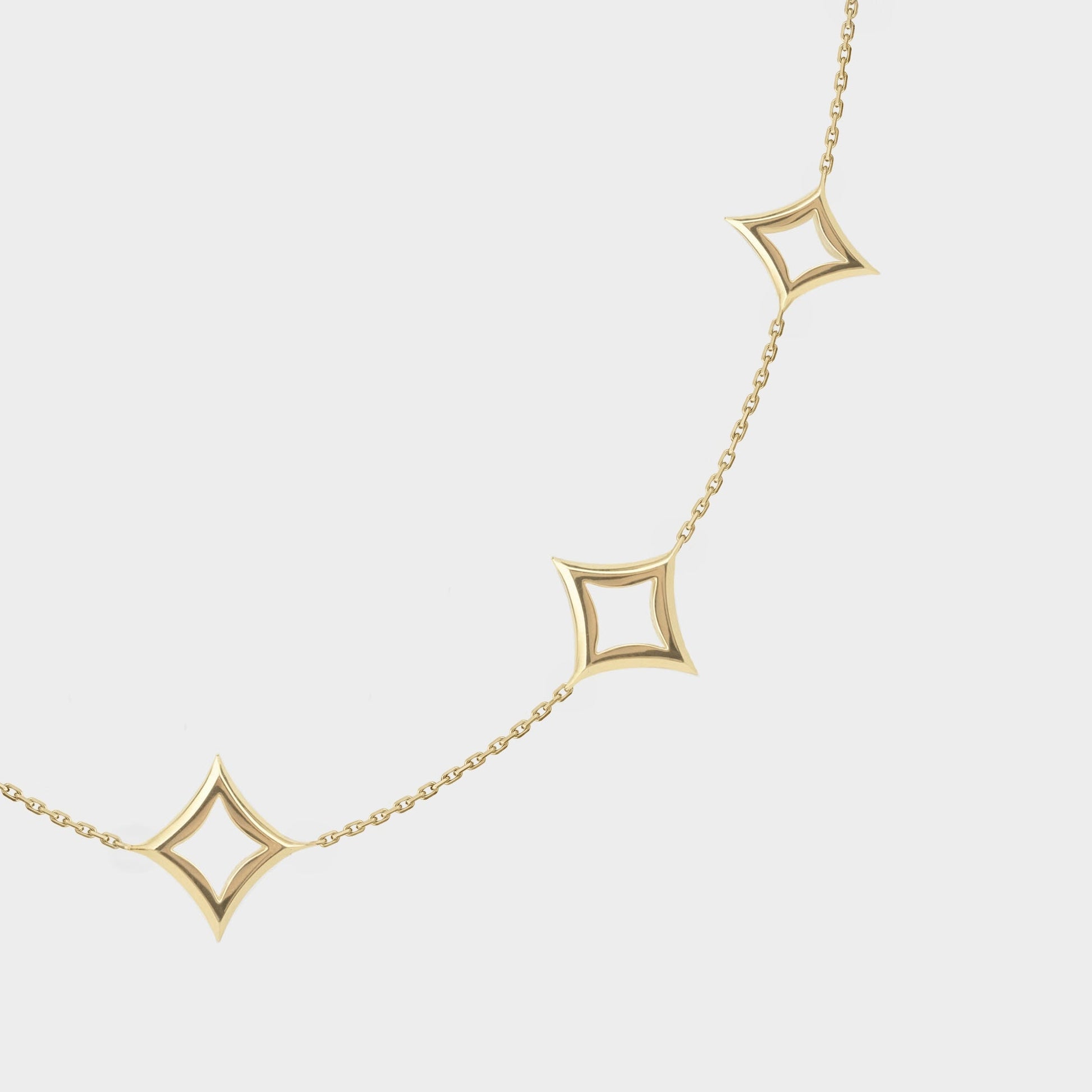Gold necklace with square pendants