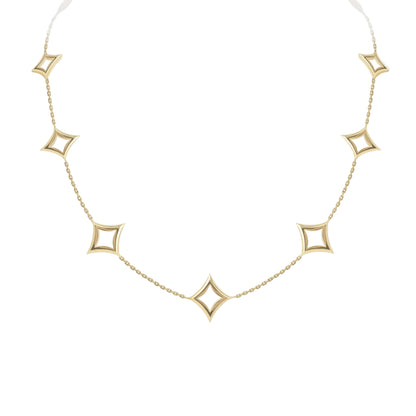 Gold necklace with star-shaped pendants on a light gray background