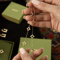 Gold necklace with square pendants