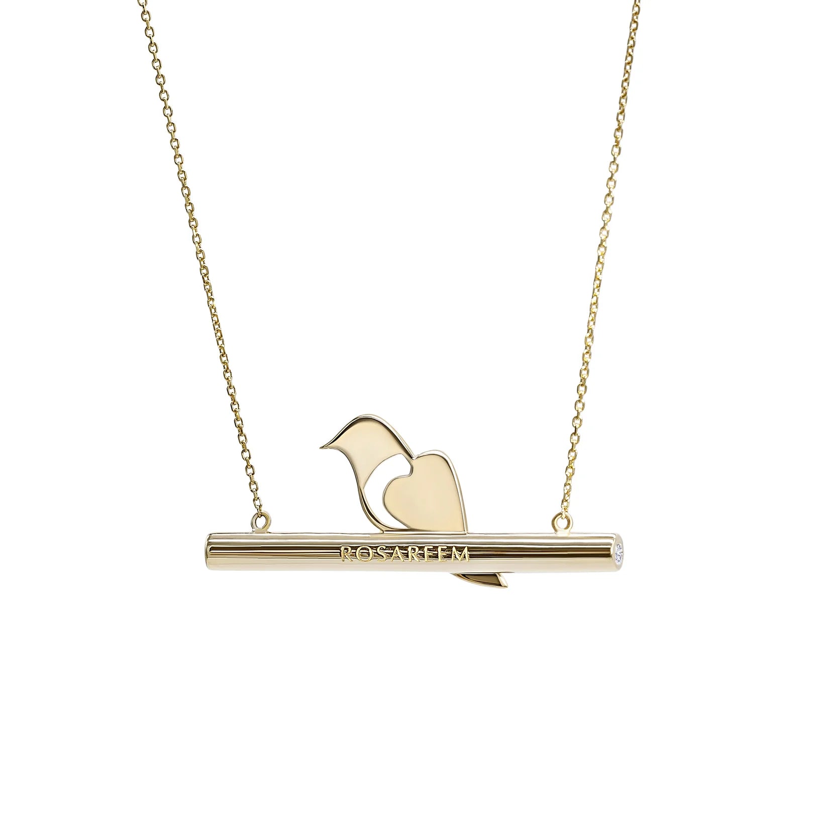 Back of gold necklace with a bird pendant on a white background