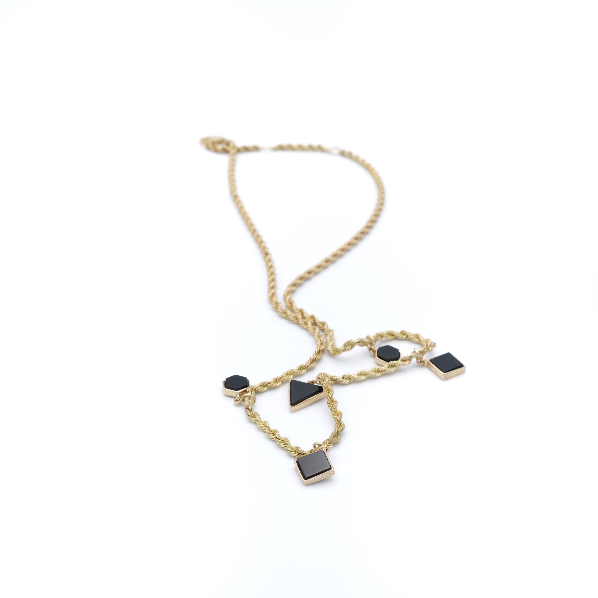 Gold necklace with black stones
