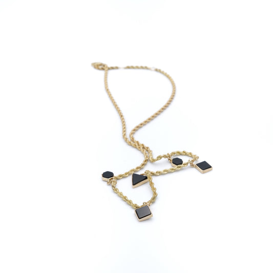 Gold necklace with black stones