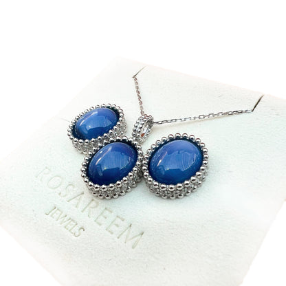 White gold necklace with blue stones on a white background