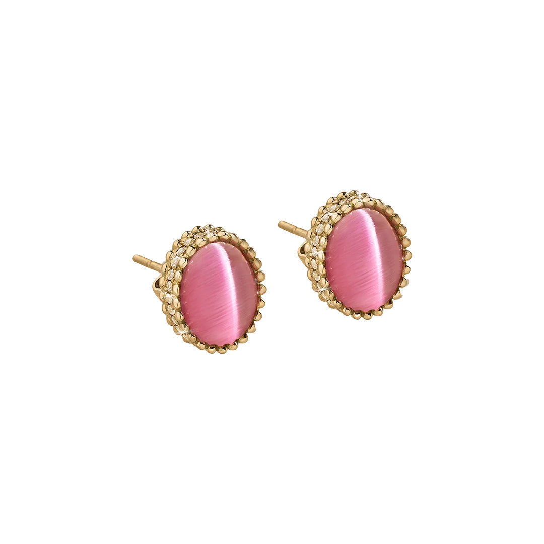 Pair of pink oval earrings with gold accents on a white background