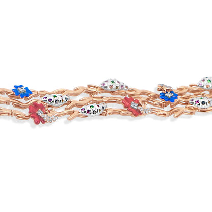 Rose gold bracelet with colorful gemstone charms on a white background