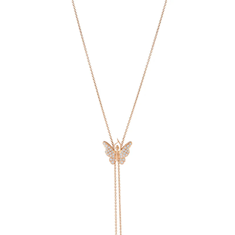 Butterfly-shaped pendant on a rose gold chain against a white background