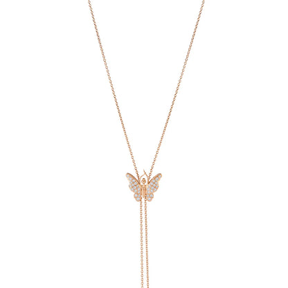 Butterfly-shaped pendant on a rose gold chain against a white background
