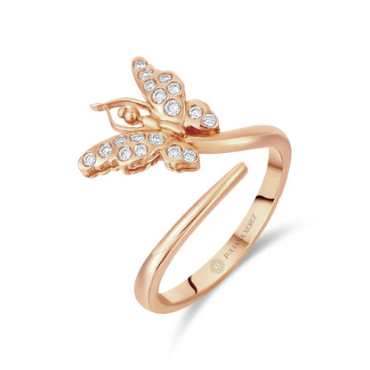 Rose gold butterfly ring with diamond accents on a white background