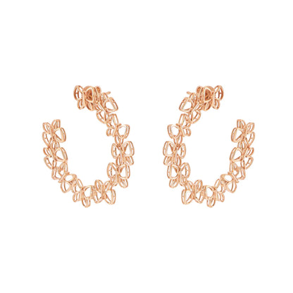 Rose gold hoop earrings on a white background