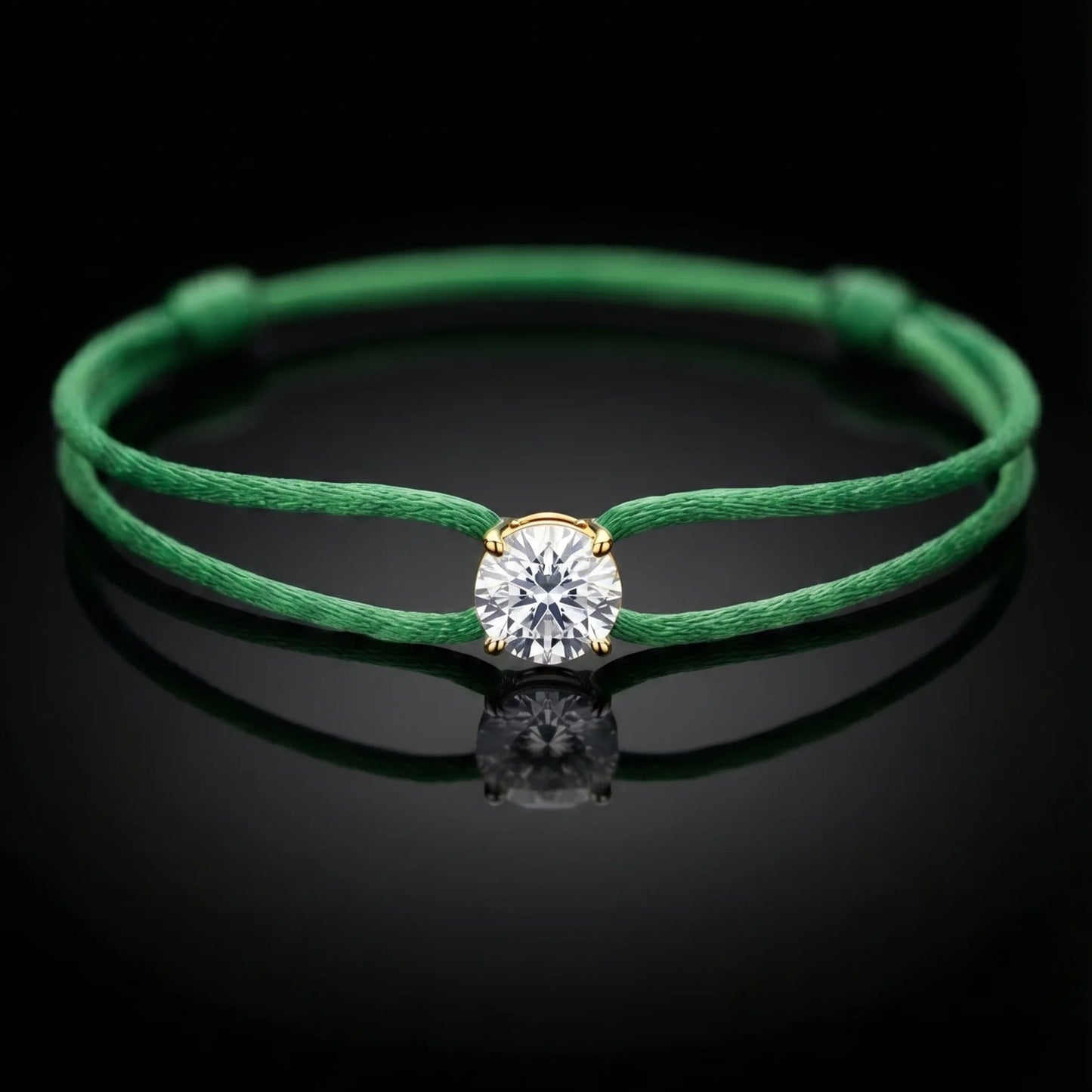 Green bracelet with a diamond on a black background