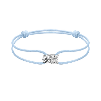 Light blue bracelet with a square charm on a white background