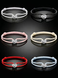 Set of six bracelets in different colors on a black background