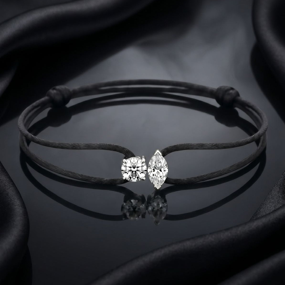 Bracelet with diamond-shaped earrings on a dark fabric background