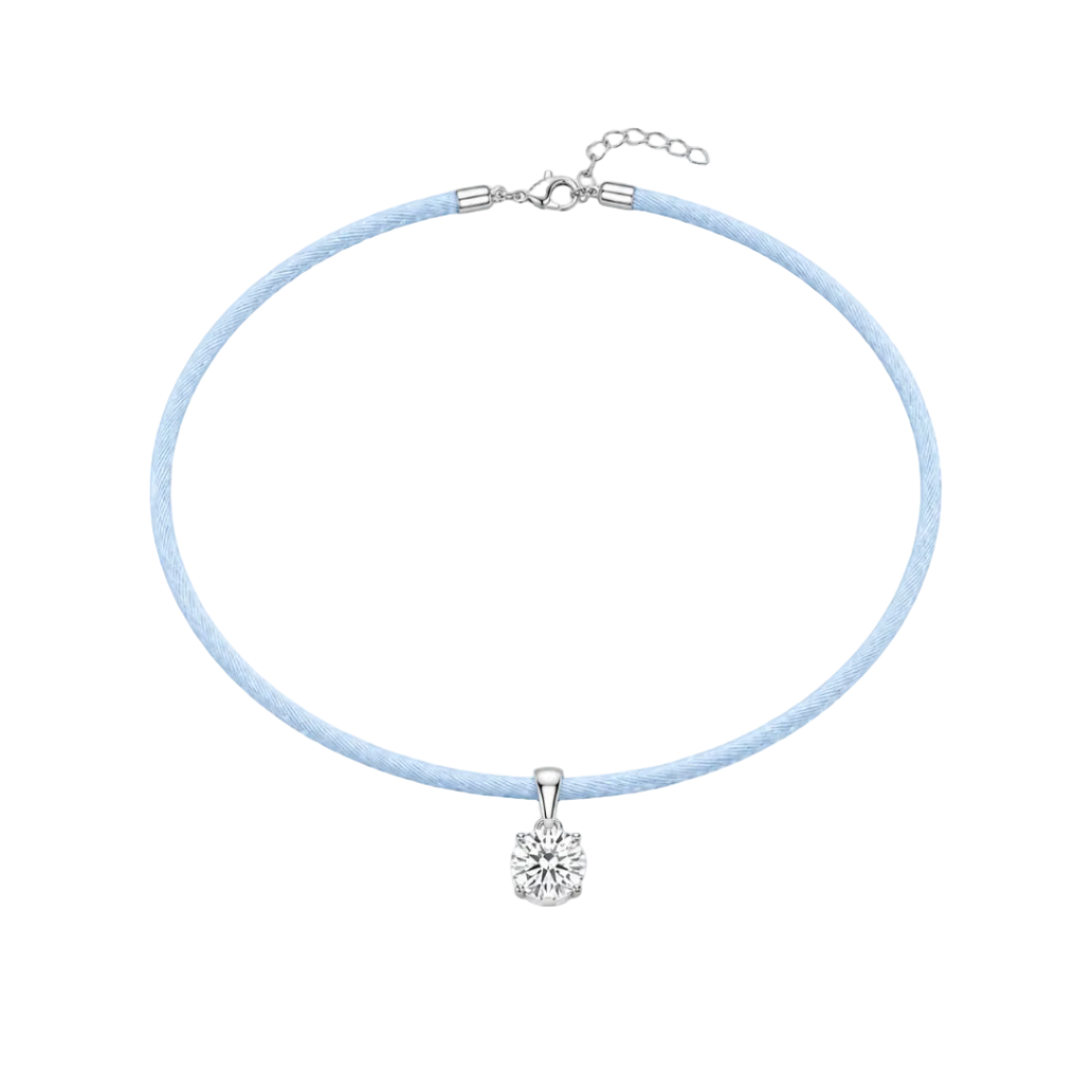 Necklace with a light blue cord and white gold clasp on a white background