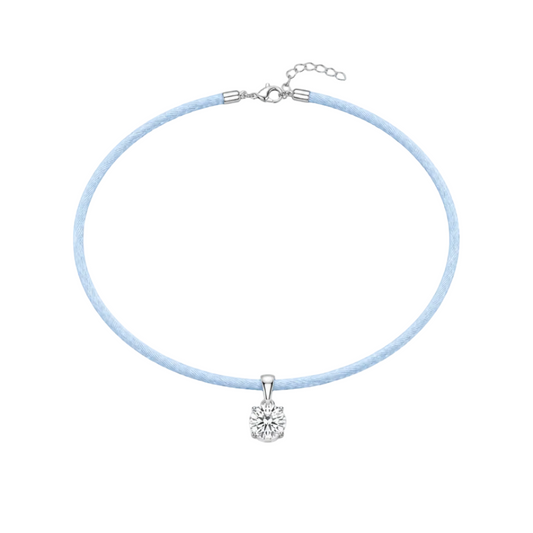 Necklace with a light blue cord and white gold clasp on a white background