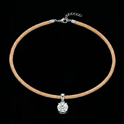 Necklace with a round pendant on a black background