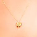 18k gold heart-shaped necklace with red enamel and diamonds, additional view