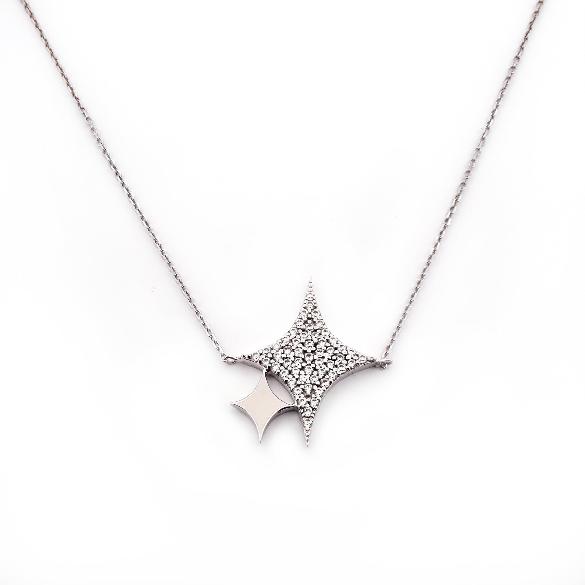 Star-shaped diamond necklace on a white background