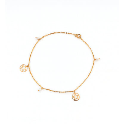 Gold anklet with circular charms on a white background