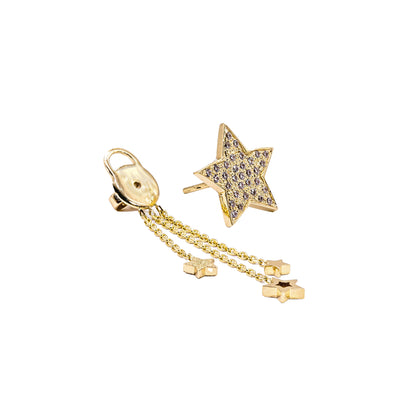 Gold star-shaped earring with chain on a white background