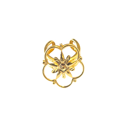 Gold ring with floral design on a white background
