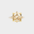 Gold ring with a yellow gemstone on a white background