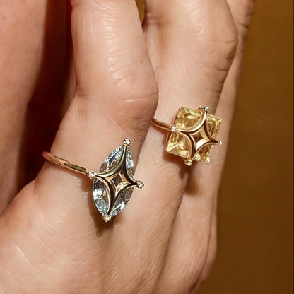 Gold ring with gemstone on a white background