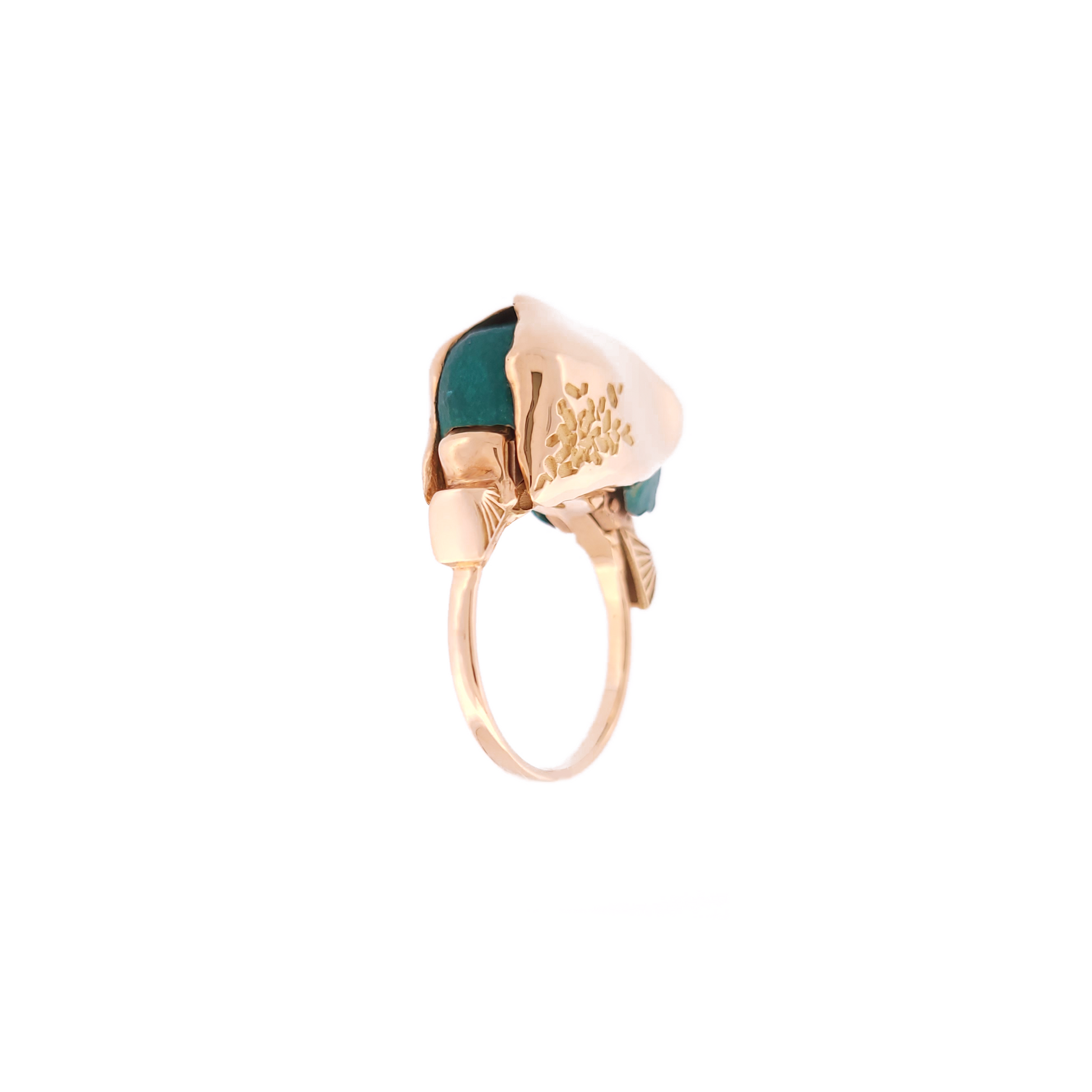 Gold ring with a diamond on a white background