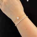 Person wearing a diamond bracelet 