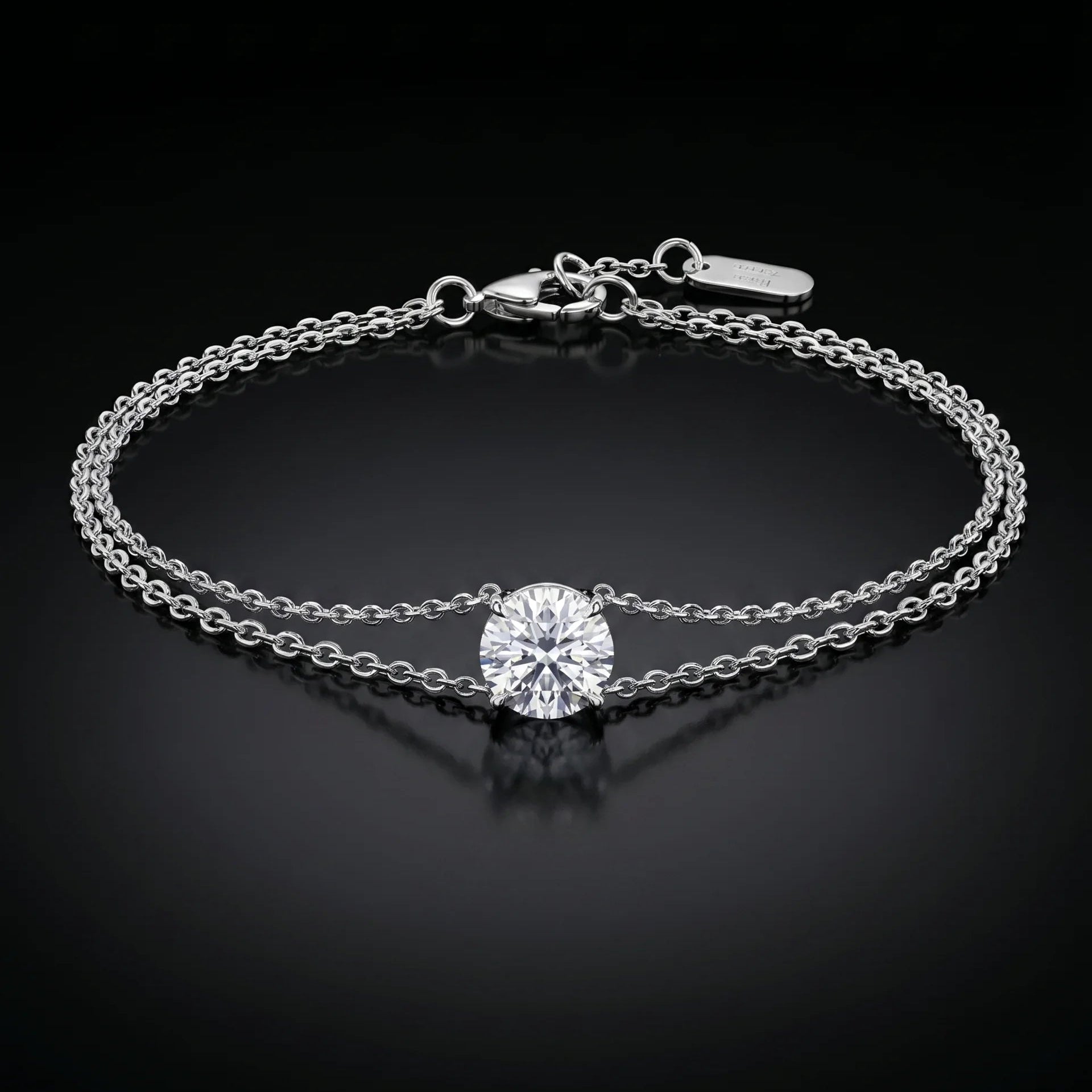 white gold bracelet with a single diamond on a black background