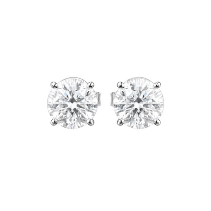 Pair of diamond stud earrings on a white background