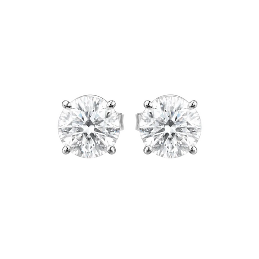Pair of diamond stud earrings on a white background