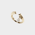 Gold ring with geometric design and teardrop-shaped diamond