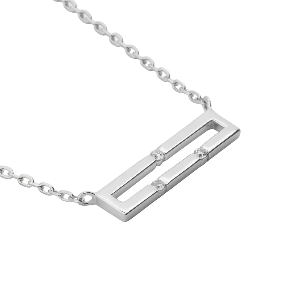 White gold necklace with a rectangular pendant on a white background
