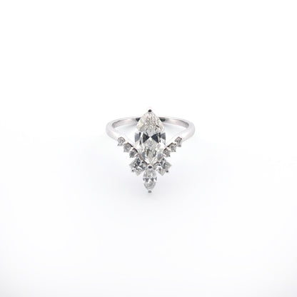 White gold ring with a marquise-shaped diamond on a white background