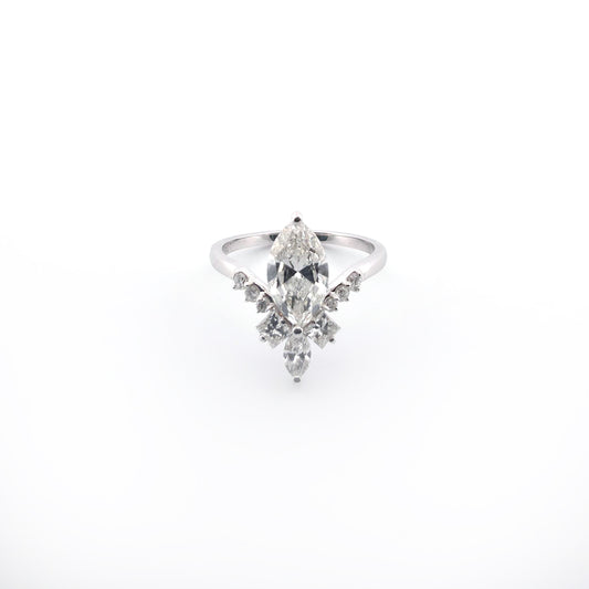 White gold ring with a marquise-shaped diamond on a white background