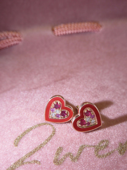 By2wenty5 Heart Studs styled on a pink jewellery surface